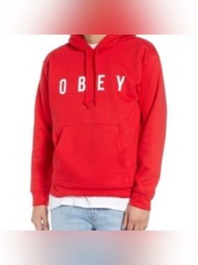 Obey red hoodie featuring a white spellout logo graphic Size Medium